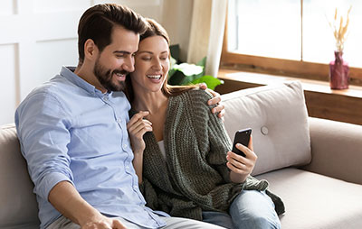 Man and woman viewing mobile