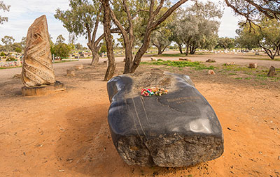 Tombstone and memorial of renowned Australian ophthalmologist Fred Hollows. Credit: Destination NSW