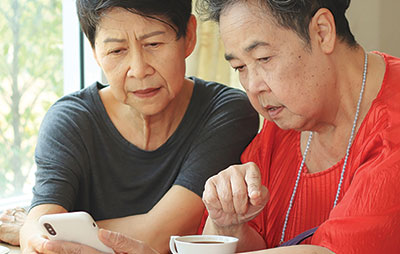 Two women looking at mobile phone