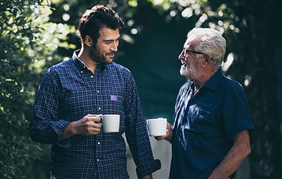 Two men talking over cuppa