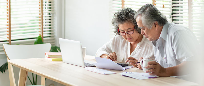 Man and woman reading paperwork